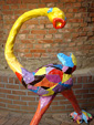 Fiberglass sculpture Proud Bird by Twan de Vos, a large colorful flamingo-like garden statue, statue for outdoor or garden bird
